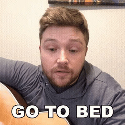 Man Playing Guitar Saying Go To Bed GIF