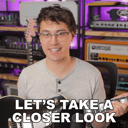 Man Playing Guitar Saying Let's Take a Closer Look