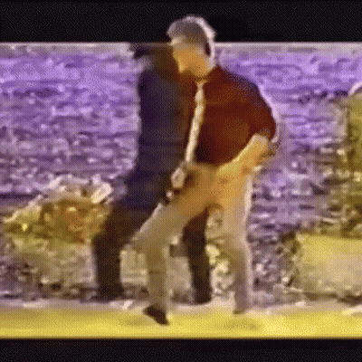 Man Playing Guitar While Another Dances GIF