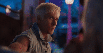Man Playing Guitar While Woman Sits On Couch In Front Of Fireplace GIF