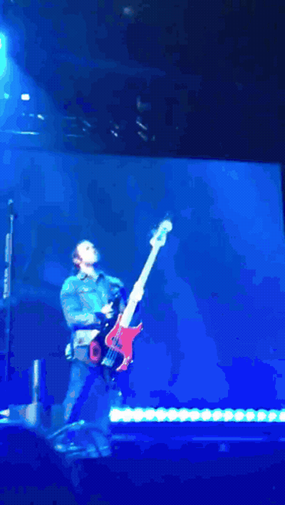 Man Playing Guitar With Flames On Stage GIF