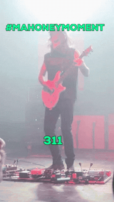 Man Playing Guitar With Number 311