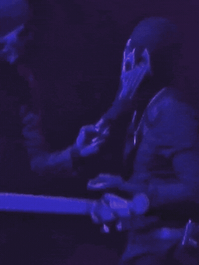 Man Playing Guitar With Skull Face GIF