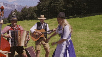 Man Playing Guitar Woman Accordion In Field GIF