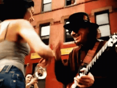 Man Playing Guitar Woman Dancing Outside Building GIF