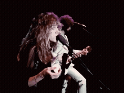 Man Playing Guitar Woman Singing Into Microphone GIF