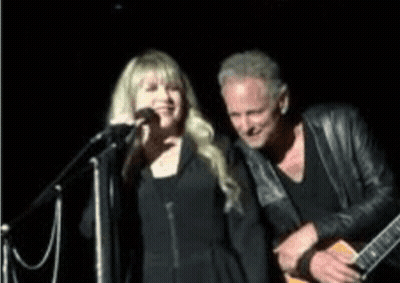 Man Playing Guitar Woman Singing Into Microphone GIF
