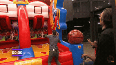 Man Playing Inflatable Basketball Game With Timer 00:00 GIF