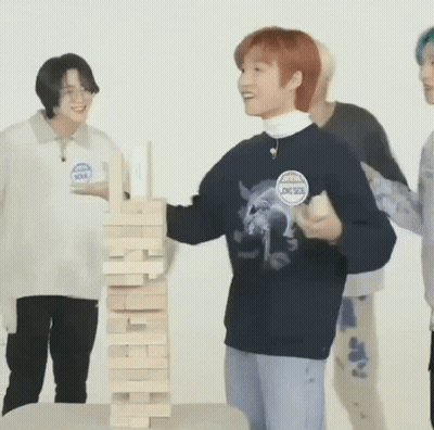 Man Playing Jenga With Young Men GIF
