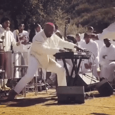 Man Playing Keyboard In Front Of Crowd GIF