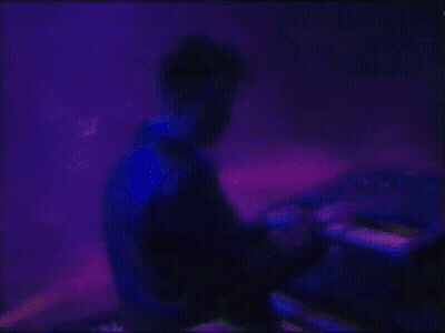 Man Playing Keyboard On Stage With Blue Light GIF