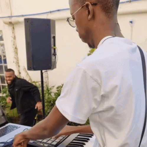 Man Playing Keyboard With Friend GIF