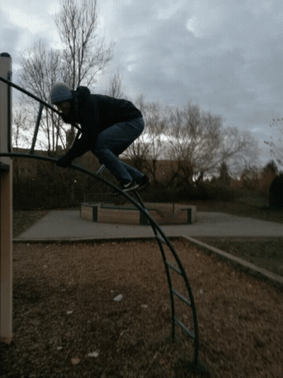 Man Playing On Monkey Bars GIF
