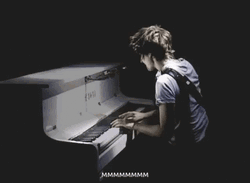 Man Playing Piano In Dark GIF