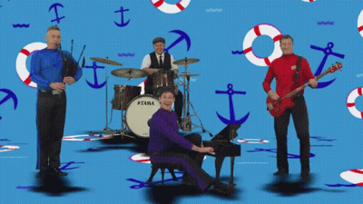 Man Playing Piano In Front Of Tama Drum Set GIF