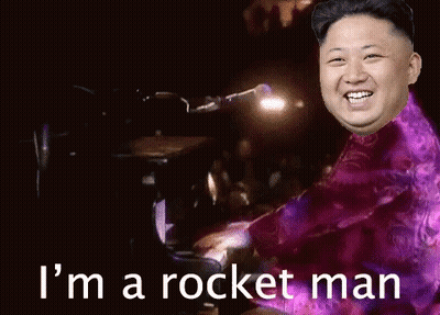 Man Playing Piano With I'm A Rocket Man Behind GIF
