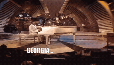 Man Playing Piano With Word Georgia GIF