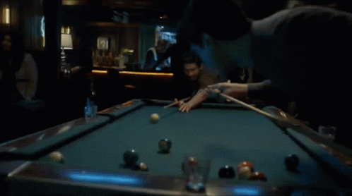 Man Playing Pool In Dark Bar GIF