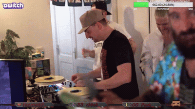 Man Playing Record On Turntable In Front Of Twitch Stream GIF