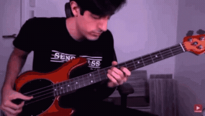 Man Playing Red Bass Guitar With Send Ass Shirt GIF