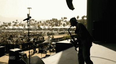 Man Playing Saxophone At Cachella Festival GIF