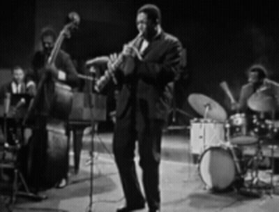 Man Playing Saxophone On Stage GIF