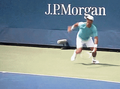 Man Playing Tennis Behind J.P. Morgan Sign GIF
