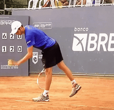 Man Playing Tennis In Front Of Banco Sign GIF