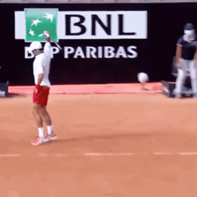 Man Playing Tennis In Front Of BNL Sign GIF