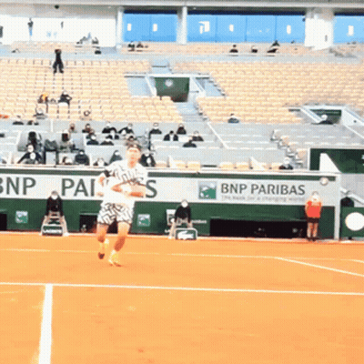 Man Playing Tennis In Front Of BNP Pariba Sign GIF