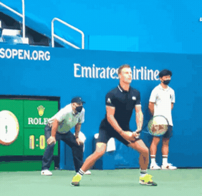Man Playing Tennis In Front Of Emirates Ad GIF