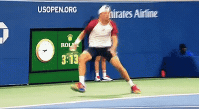 Man Playing Tennis In Front Of Emirates Ad GIF