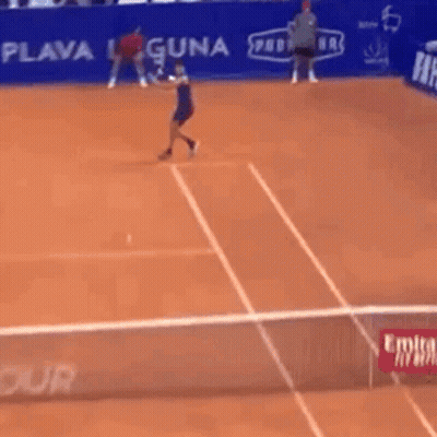 Man Playing Tennis In Front Of Hotel Banner GIF