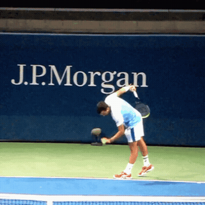 Man Playing Tennis In Front Of J.P. Morgan Ad GIF