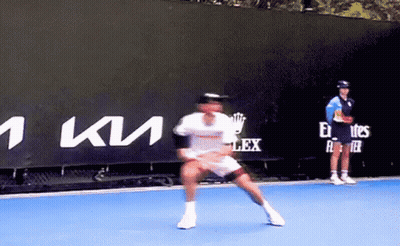 Man Playing Tennis In Front Of Kia Sign GIF