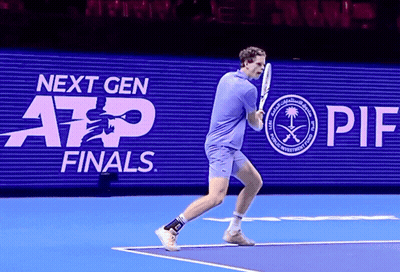 Man Playing Tennis In Front Of Next Gen Finals Sign GIF