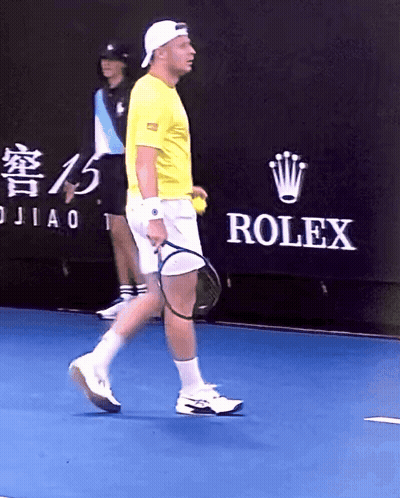Man Playing Tennis In Front Of Rolex Banner GIF