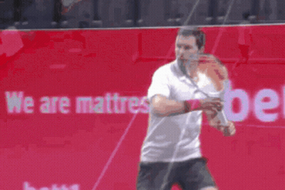 Man Playing Tennis In Front Of We Are Mattress Ad GIF