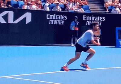 Man Playing Tennis On Court With Emirates Fly Better GIF