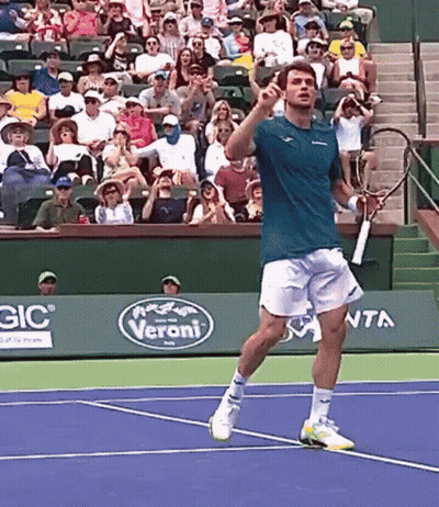 Man Playing Tennis On Court With Veroni Sign GIF