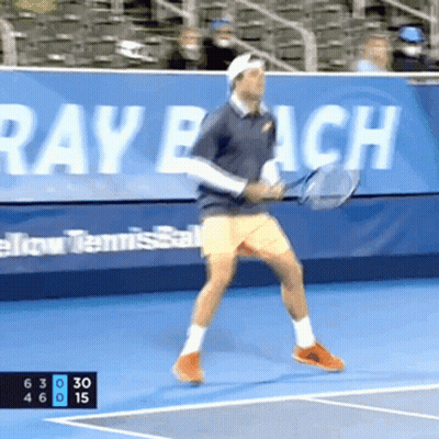 Man Playing Tennis With Mutua Madrilena Banner GIF