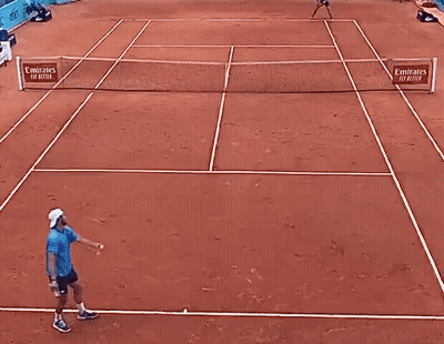 Man Playing Tennis With Mutua Madrilena Banner GIF