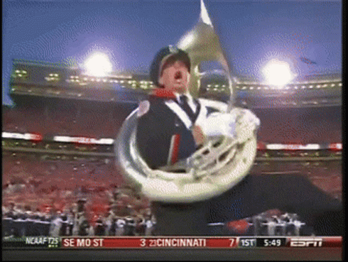 Man Playing Trumpet In Stadium Score 3 To 2 GIF