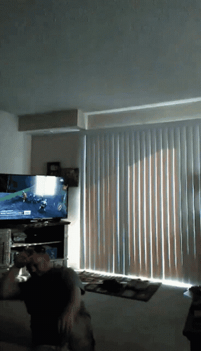 Man Playing Video Game On Flat Screen TV GIF
