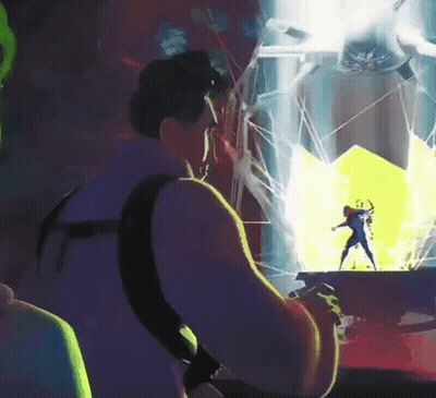 Man Playing Video Game With Superhero On Screen GIF