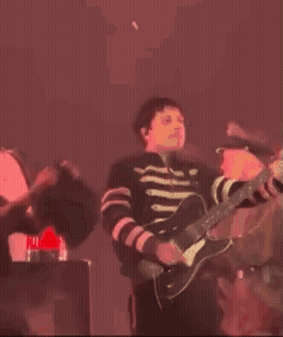 Man Playing Violin On Stage In Dark Room GIF