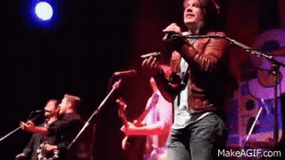 Man Playing Violin Singing On Stage GIF