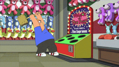 Hombre jugando al Whack a Box GIF