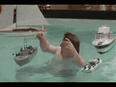 Man Playing With Boats GIF