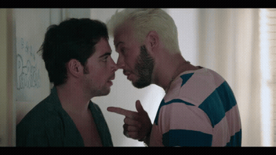 Man Pointing At Another Man's Nose In Front Of Pepsi Wall GIF